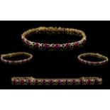 14ct Gold Ladies Ruby and Diamond Set Bracelet with X Design.