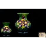 Moorcroft Small Globe Shaped Tubelined Vase, 'Columbine' design,