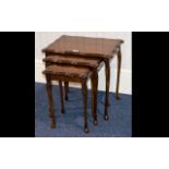 A Nest of Tables mahogany table of shaped form with long cabriole legs.