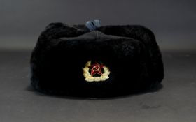 Soviet Ushanka Hat Traditional trapper hat in black faux fur with quilted cotton lining and enamel