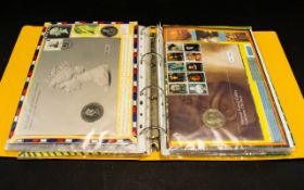 Coin and Stamp Cover Album with about 22 covers, several collectable coins.