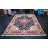 A Large Woven Silk Carpet Keshan rug with blue ground and traditional Middle Eastern floral and