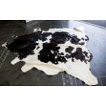 Large Cowhide Rug Of traditional form in chocolate brown and cream fur hide, some areas of wear/