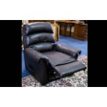 A Contemporary Leather Reclining Chair Plush chair upholstered in black pebbled leather with massage