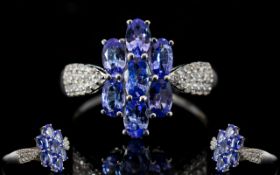 Tanzanite Cluster 9ct White Gold Ring with natural white zircon accent shoulders,