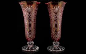 A Pair Of Cut Glass Cranberry Vases Two in total each of trumpet form raised on fluted base with