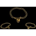 A 9ct Gold Curb Bracelet with 9ct Gold Heart Shaped Padlock - Solid construction and fully