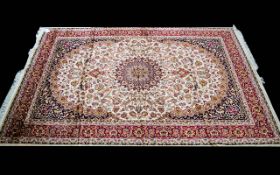 A Large Woven Silk Carpet Keshan rug with beige ground and traditional Middle Eastern floral and