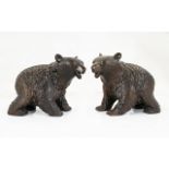 A Pair Of Black Forest Style Carved Bears Two black bears in prowling stance with glass eyes,