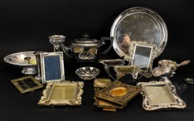 A Mixed Box Of Silver Plated Items To include basket, photo frames, three piece tea set,