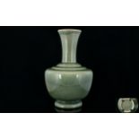 Chinese Crackle Glaze Celadon Vase With Ovoid Body And Trumpet Neck.