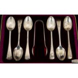 A Boxed Set of Six Silver Teaspoons with matching pair of Sugar Tongs. Hallmarked Sheffield 1930.