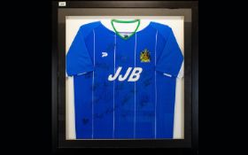 Football Interest Framed And Glazed Wigan Athletic Signed Football Shirt. Housed in contemporary