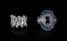 Two Silver And Cz Dress Rings Each marked 925, each with contemporary designer settings.