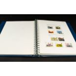 Stamp Interest Blue A4 multiring stamp album with largely complete set of GB stamps from 1971 to