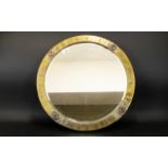 Arts And Crafts Style Bevelled Glass Mirror circular mirror in planished brass frame.