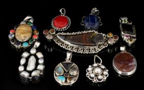 A Mixed Collection of Sterling Silver And Semi Precious Stone Set Pendants nine items in total to