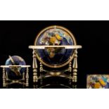 World Globe Set With Lapis And Gemstones On brass lacquered stand with compass.