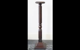 Antique Darkwood Jardinere Stand raised on stepped square base with turned column and circular top.