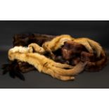 A Collection of Fur comprising two sets of mink stoles/tippets with head and tails and a dark brown