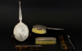 A Collection Of Silver Backed Ladies Dressing Table Items To include three combs, hand mirror,