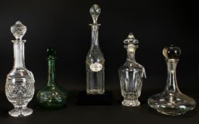 A Collection of Top Quality Cut Glass & Lead Crystal Decanters of various sizes and shapes.