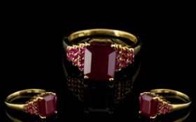 Ruby Octagon Solitaire Ring with stepped ruby shoulders; the solitaire,