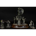 A Large Pewter And Crystal Figure Group In the form of mythical dragon surrounded by a group of