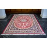 A Large Woven Silk Carpet Keshan rug with red ground and traditional Middle Eastern floral and