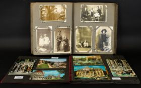 Two Postcard Albums Containing A Quantity Of Cards The first,