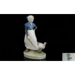 Royal Copenhagen Vintage Figure 'Woman with Goose' circa 1955, model 528.