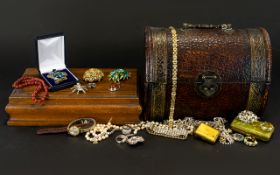 A Mixed Collection Of Costume Jewelry Items Contained within faux reptile skin casket form box.