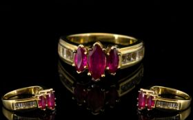 Ruby Marquise and White Topaz Ring, a 1ct marquise cut ruby flanked by two smaller, similar, rubies,