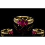 Ruby Marquise and White Topaz Ring, a 1ct marquise cut ruby flanked by two smaller, similar, rubies,