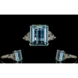 Platinum Set Aquamarine And Diamond Ring Set with a large faceted emerald cut aquamarine of