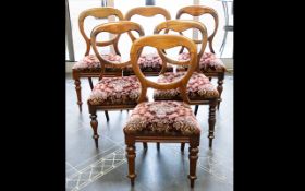 Six Balloon Back Dining Chairs each with turned legs,