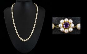 Mikimoto Fine Quality Single Strand Graduated Pearl Necklace with 9ct Gold Clasp set with Amethyst