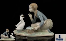 Lladro Porcelain Figure 'Feeding the Ducks' model No. 4849. Issued 1973-1995. Height 6.5" - 16.