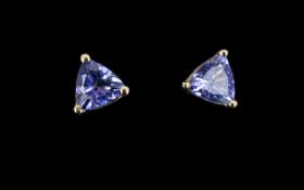 Tanzanite Pair of Trillion Cut Stud Earrings set in 9ct gold, the deep vivid blue tanzanites,