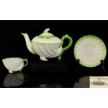 Irish Stunning Quality Belleek 2nd Period Tea Pot with Neptune design/pattern raised on shell feet.