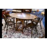 An Oak Drop Leaf Dining Table And Chairs By Bath Easton And Chingford Gate leg construction with