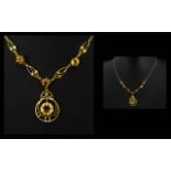 A 9ct Gold And Citrine Pendant Drop Necklace Lariat form necklace set with three faceted bright