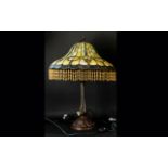 A Reproduction Tiffany Style Table Lamp Hexagonal cast metal base with opalescent geometric design