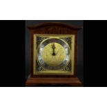 A Modern Reproduction Mantle Clock Wooden cased with etched and brushed gold tone face and silver