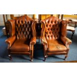 A Pair Of Chesterfield Wing Back Armchairs Button Back chairs, with drop in seats,