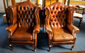 A Pair Of Chesterfield Wing Back Armchairs Button Back chairs, with drop in seats,