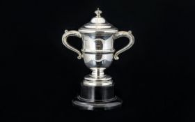 Walker And Hall Quality And Impressive Twin Handle Trophy Cup Raised on stepped, black lacquered