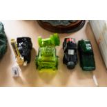 A Collection Of Four Novelty Avon Scent Bottles Each modelled in the form of a vehicle. To include