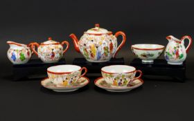 Japanese Part Tea Service Comprising teapot, two cups and accompanying saucers, sugar bowl and