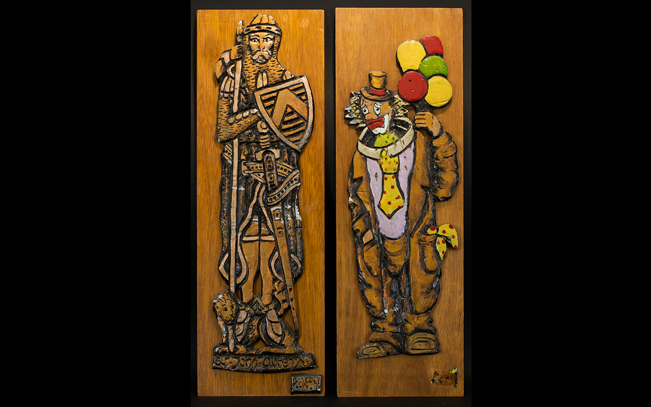 A Pair Of Embossed Figurative Wooden Pan